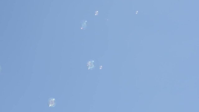 Soap bubbles floating in the clear blue sky slow-mo 1920X1080 HD video - Slow motion soap-bubbles in the air relaxing background 1080p FullHD footage 