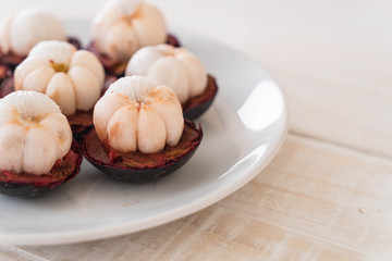 fresh mangosteen on wood