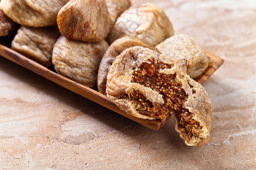  dried figs in wooden dish