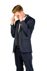 Young businessman in despair clutched his head. Crisis concept.