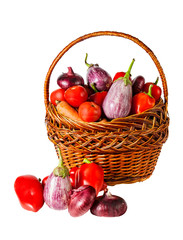 Vegetables in basket isolated on white background