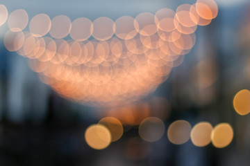 vintage tone blur image of night festival on street with bokeh , for background usage