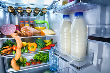 Open refrigerator filled with food