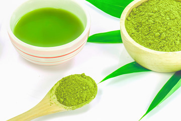 Matcha Tea in the wooden bowl isolated on white background