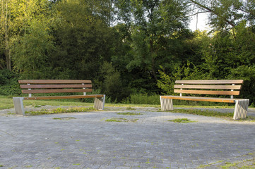 Benches for rest are in the park.