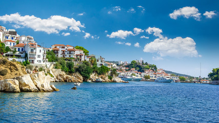 Skiathos town on Skiathos Island, Greece. Beautiful view of the old town with boats in the harbour.