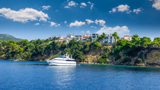 Skiathos town on Skiathos Island, Greece. Beautiful view of the old town with boats in the harbour.