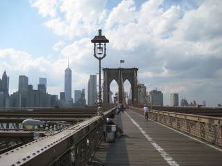 Brooklyn Bridge famous symbol of New York City with downtown Manhattan skyscrapers landscape, sky,...