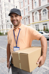 Young man making home delivery