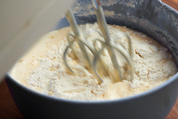 Electric mixer beats mass of batter