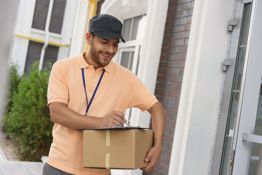 Young man making home delivery