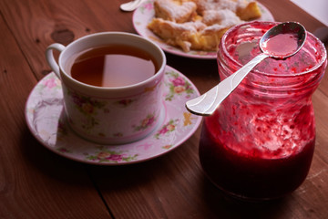 pieces of apple pie on a plate with tea