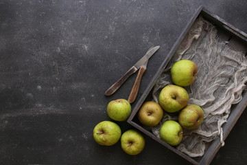 green apple on dark table