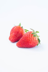 Strawberry on white background fruit's healthful cordial, useful