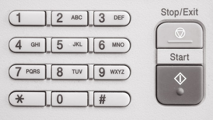 Closeup surface number keypad at the old photocopier in the office textured background in black and white tone