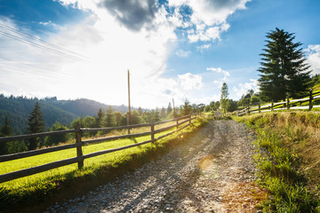 Beautiful view of countryside road. Mountains background.