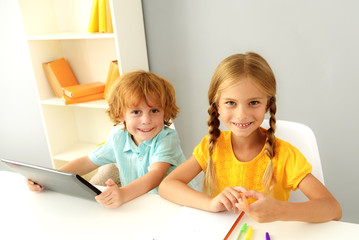 cute preschoolers studying indoors