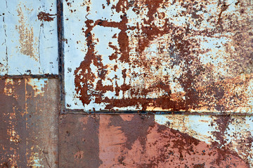 rusty metal sheets of different colors welded together