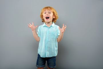 funny redhead kid standing alone