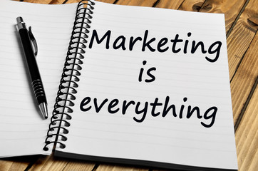 Marketing is everything words on notebook