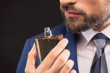 Successful businessman likes perfume scent