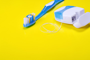 Toothbrush and dental floss