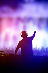 Charismatic disc jockey at the turntable.