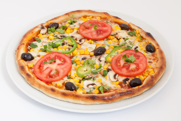 Delicious italian pizza with vegetables & cheese on white plate