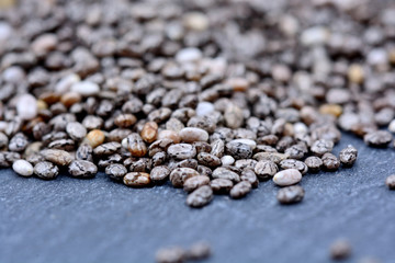 Many chia seeds on slate