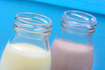 Bottles with vanilla and chocolate milkshake