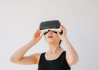 Asian woman using the virtual reality headset