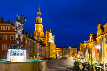 Night photo of Poznan Old Town with Saint John of Nepomuk statue and numerous of illuminated...