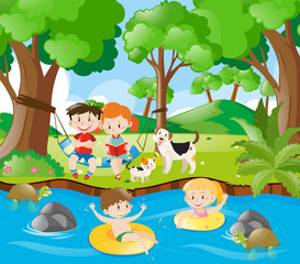 Obraz na płótnie Canvas Kids having fun in the river