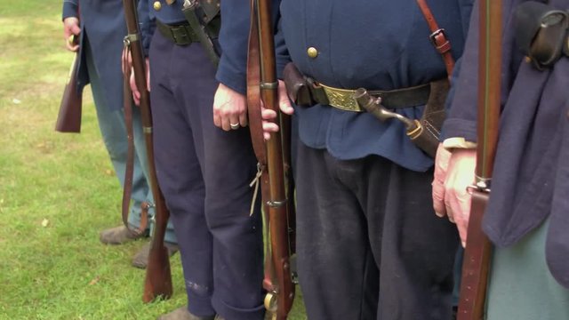 Steady cam shot of Civil War soldiers in a row