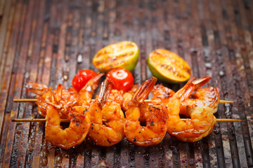 Fresh hot grilled shrimp skewers on the grill