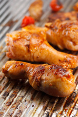 Hot grilled chicken legs on the grill