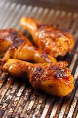 Hot grilled chicken legs on the grill