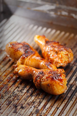 Hot grilled chicken legs on the grill