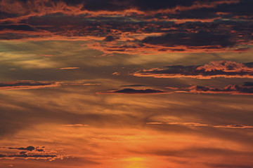 bright red sky with clouds at sunset