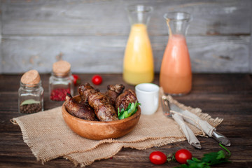 Beef stuffed with mushrooms in a bowl on a wooden table