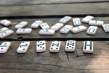 dominoes on a table scattered in nature after the game