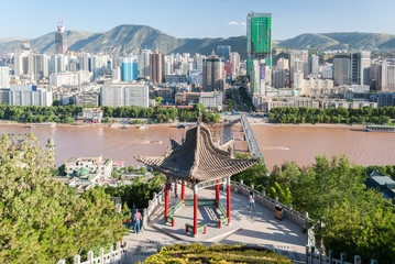 Panoramic view of Lanzhou (China) with a traditional temple in the foreground
