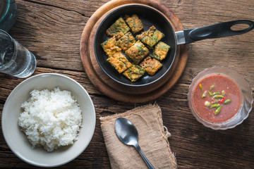 Fried Acacia Pennata, Climbing Wattle with egg and shrimp paste chilli sauce (cha-om kai in Thai)