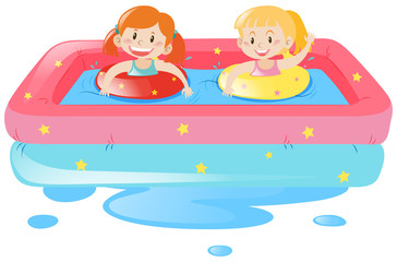 Obraz na płótnie Canvas Two girls in portable pool