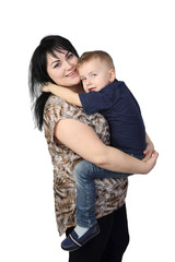 Motherhood and son's love - Little boy embraces black haired woman which holds him on hands isolated on white background