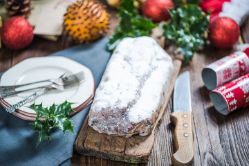 Christmas stollen cake on festive decorated table