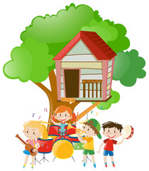Obraz na płótnie Canvas Children playing music under the tree