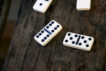 Dominoes scattered on the table, after playing outdoors
