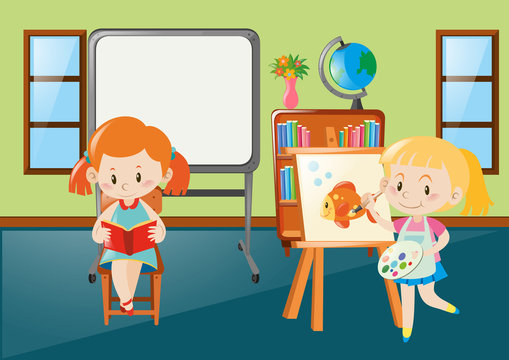 Girls reading and drawing in classroom