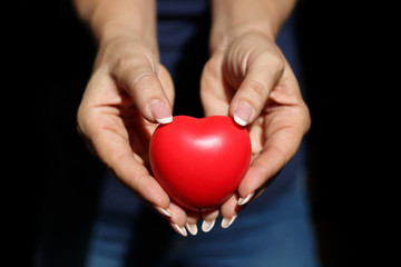 Fototapeta premium close up of woman hands showing red heart